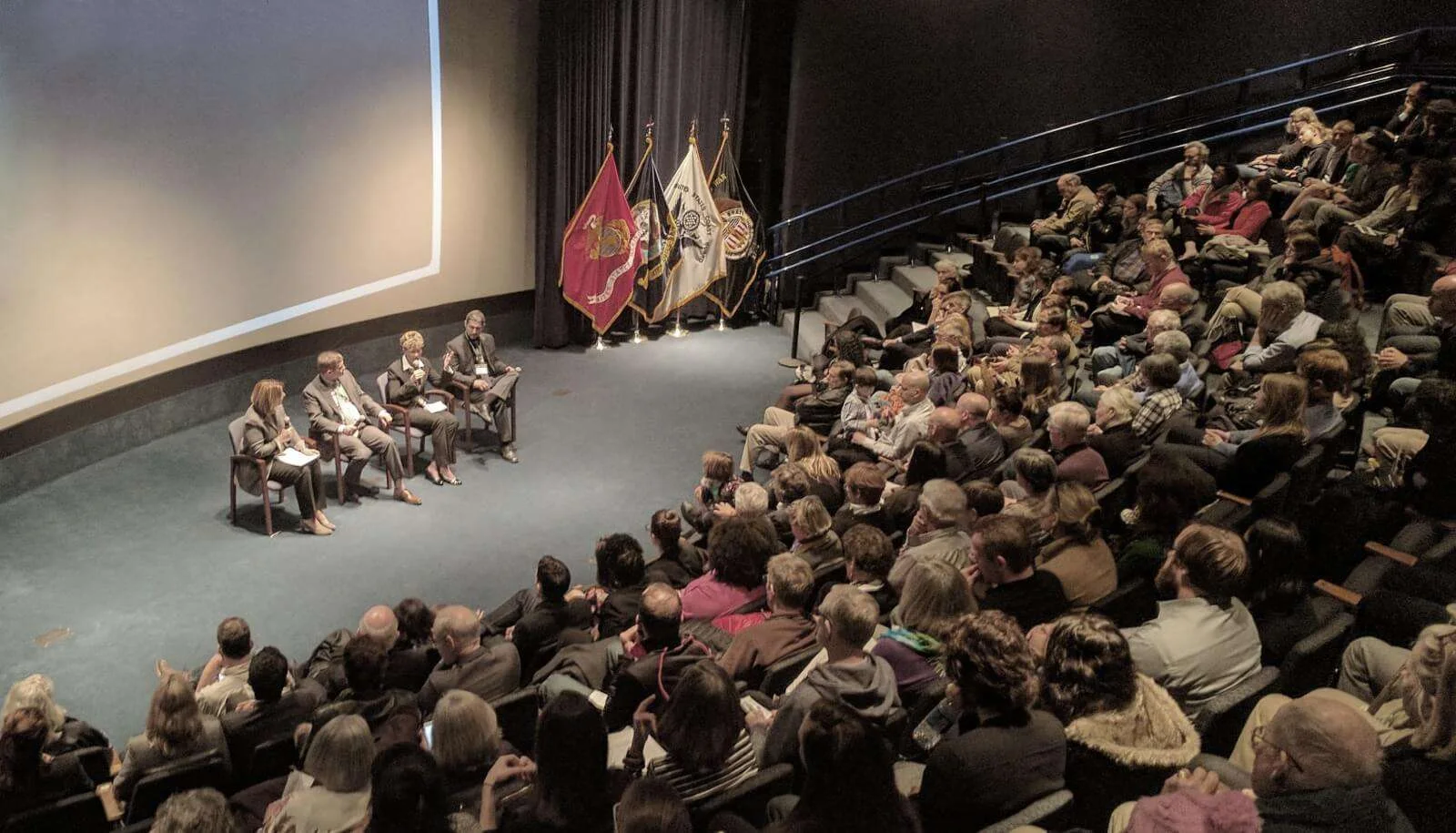 Roger Sorkin conducting an on-site stakeholder diagnostic presentation in an auditorium